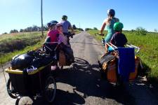 Family biking on a country lane.
