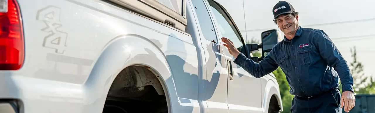 An installer from Allison's Manufacturing LTD ready to board his service truck