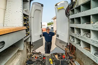 Technician guy with his service truck