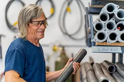 Technician guy with garage door spring