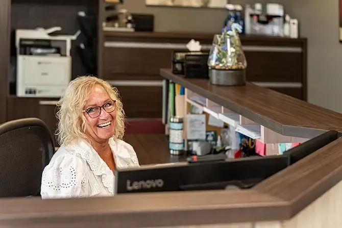 Allison's Manufacturing Ltd receptionist behind her desk